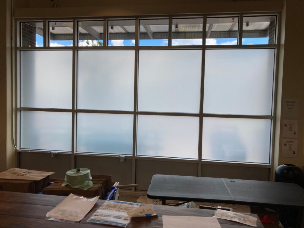 Privacy window film in a room with many windows